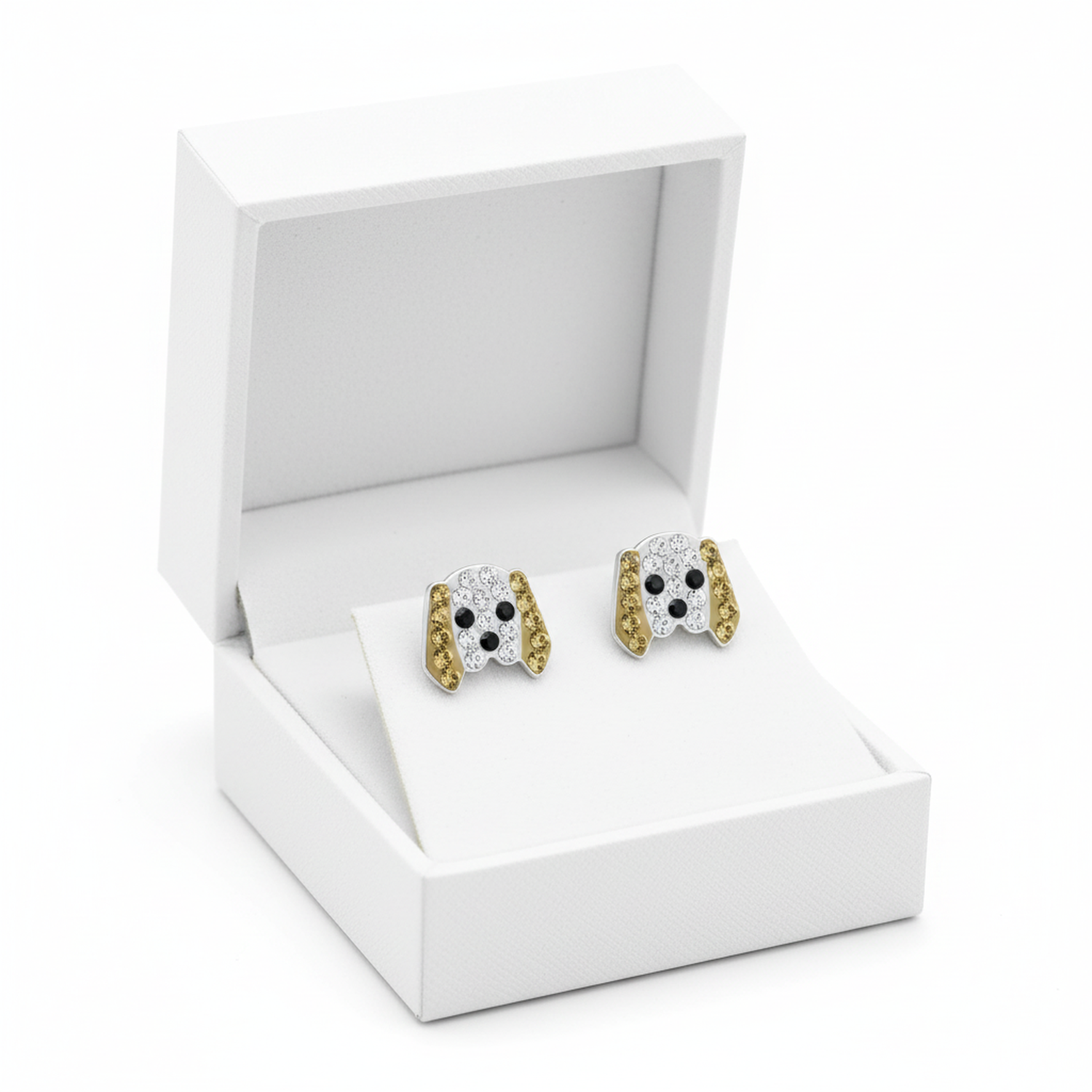 Girls Dog Stud Earrings in silver and gold tones with black eyes displayed in white Melchior Jewellery box