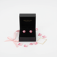 Girls pink flower stud earrings by Melchior Jewellery in black gift box with pink ribbons and petals