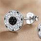 Girls sterling silver football earrings by Melchior Jewellery with sparkling clear and black stones