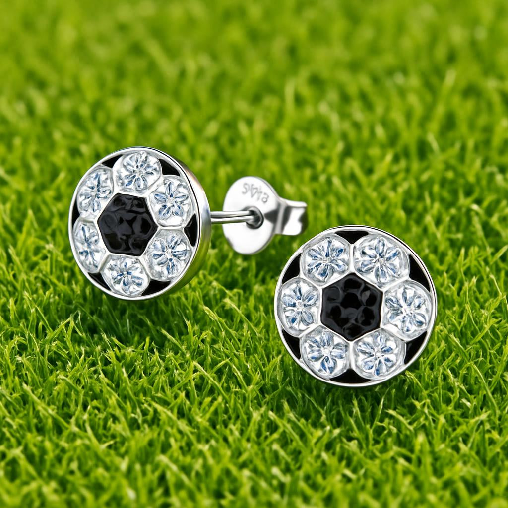 Melchior Jewellery girls sterling silver football earrings with black and white design on green grass