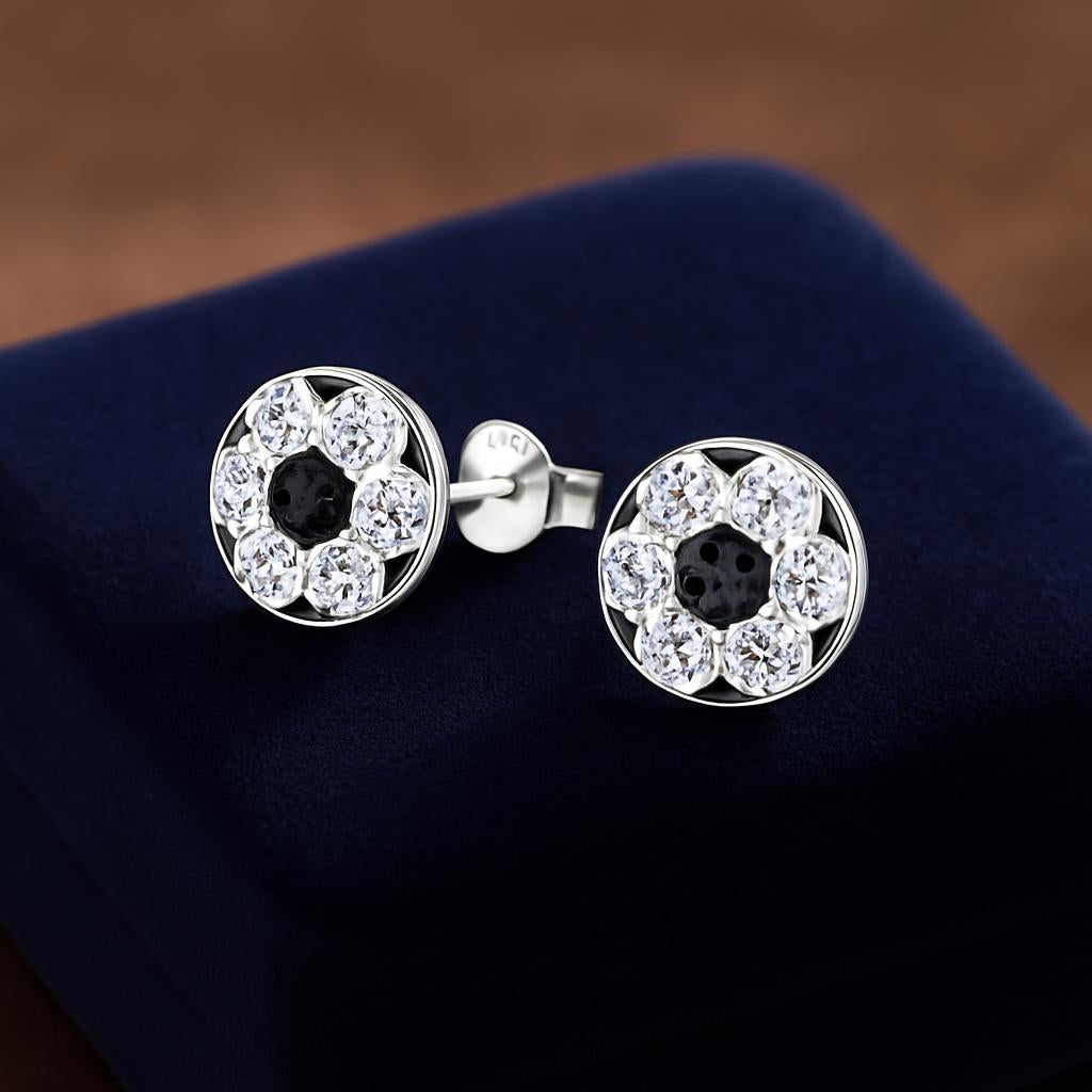 Melchior Jewellery girls sterling silver football earrings with crystal detailing on navy blue velvet