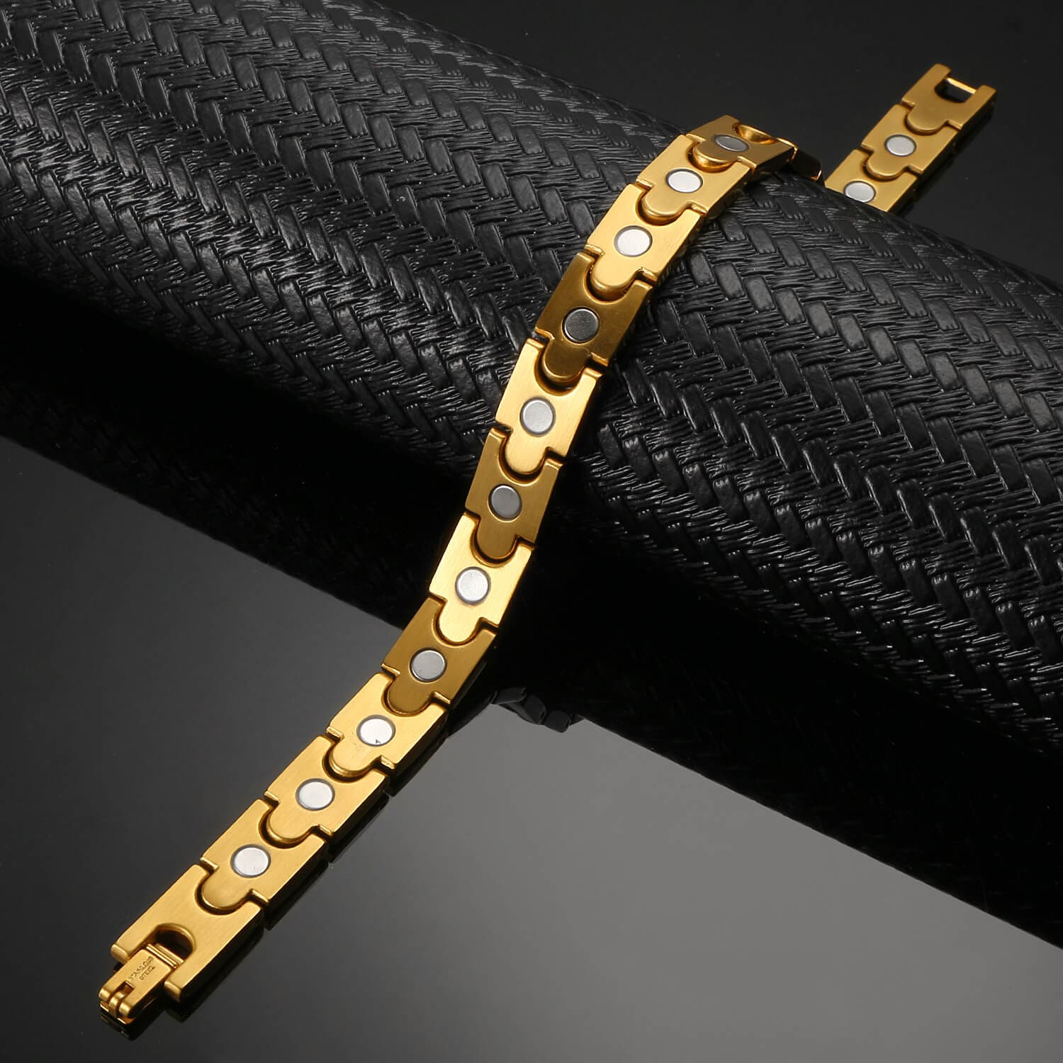Melchior Jewellery gold titanium magnetic therapy bracelet with polished link design and circular magnetic inserts