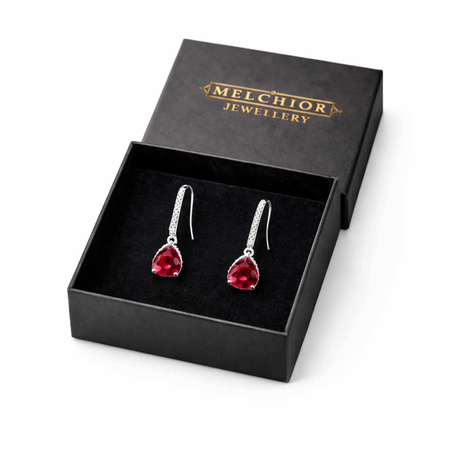 Melchior Jewellery ruby red drop earrings with silver hooks and sparkling gemstone accents in black gift box