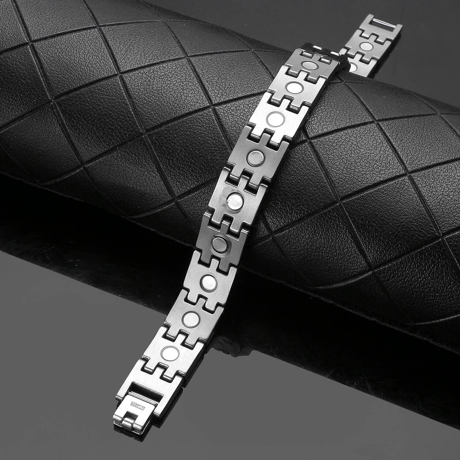Melchior Jewellery mens silver titanium magnetic bracelet brushed link design with round magnets on black display
