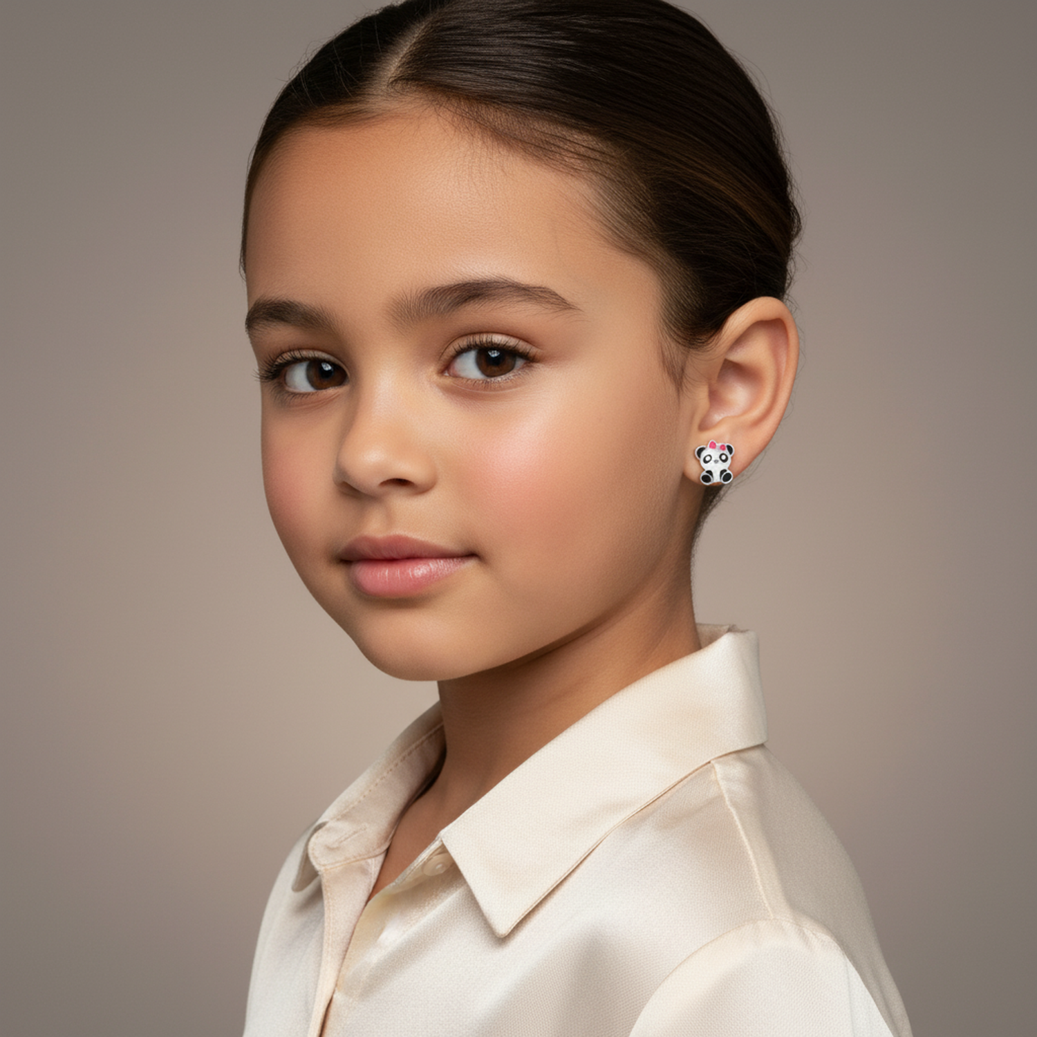 Melchior Jewellery panda stud earrings for little girls worn by a young girl with neat hair and cream shirt