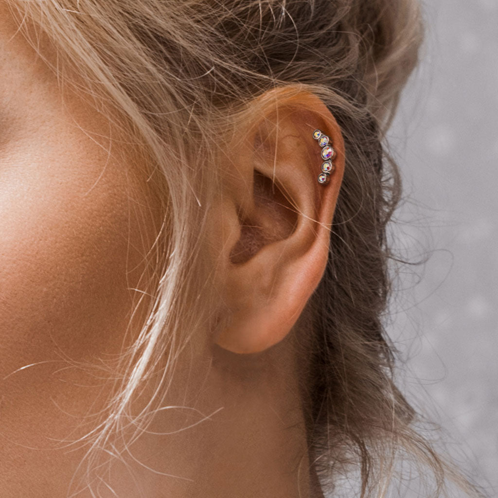 Melchior Jewellery surgical steel cartilage stud with gemstones worn on upper ear helix close up