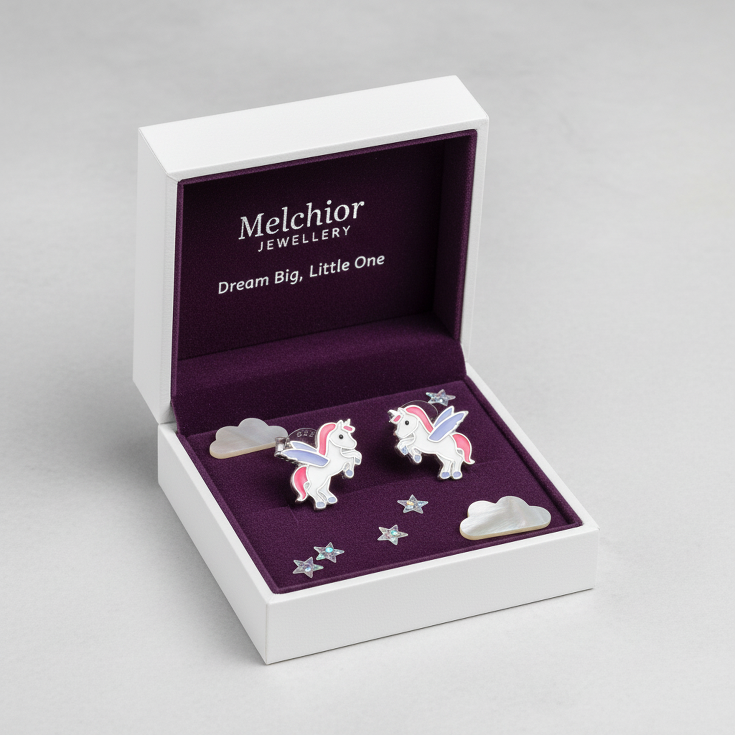 Cute silver unicorn earrings for children by Melchior Jewellery in a white gift box with stars and clouds