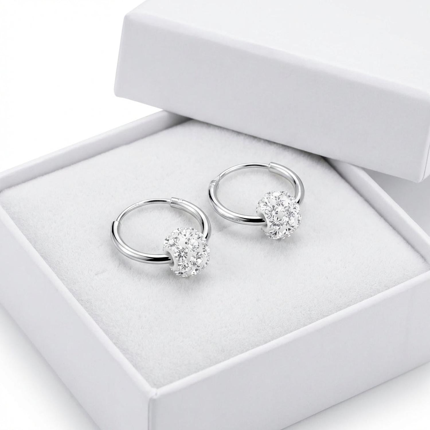 Silver kids crystal ball charm earrings with sparkling clear crystals in white jewellery box