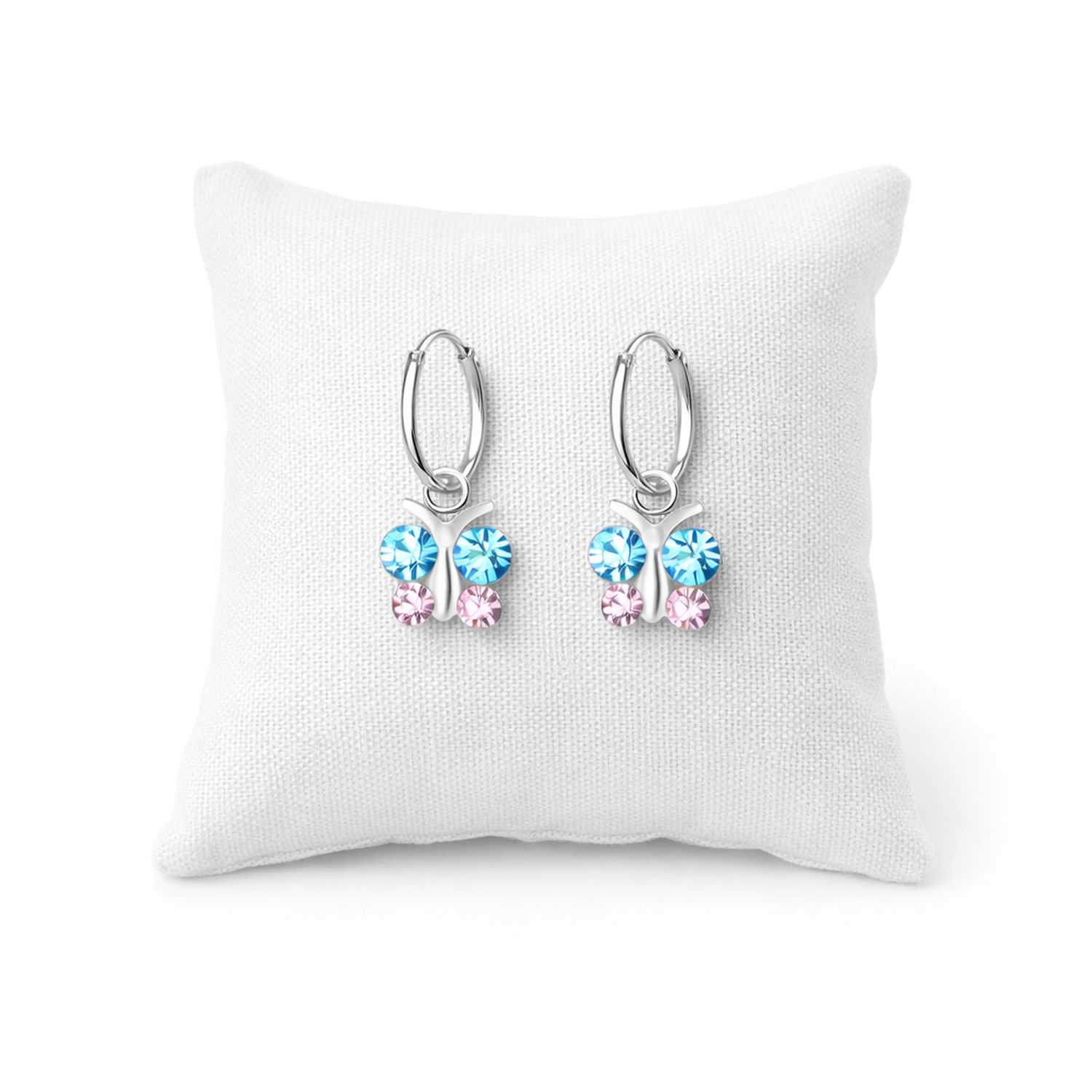Melchior Jewellery kids crystal butterfly hoop earrings with blue and pink stones on white cushion