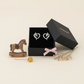 Melchior Jewellery kids heart shaped horse stud earrings displayed in a black gift box with decorative horse and flowers
