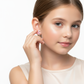 Melchior Jewellery kids hypoallergenic flamingo screw back earrings worn by child model