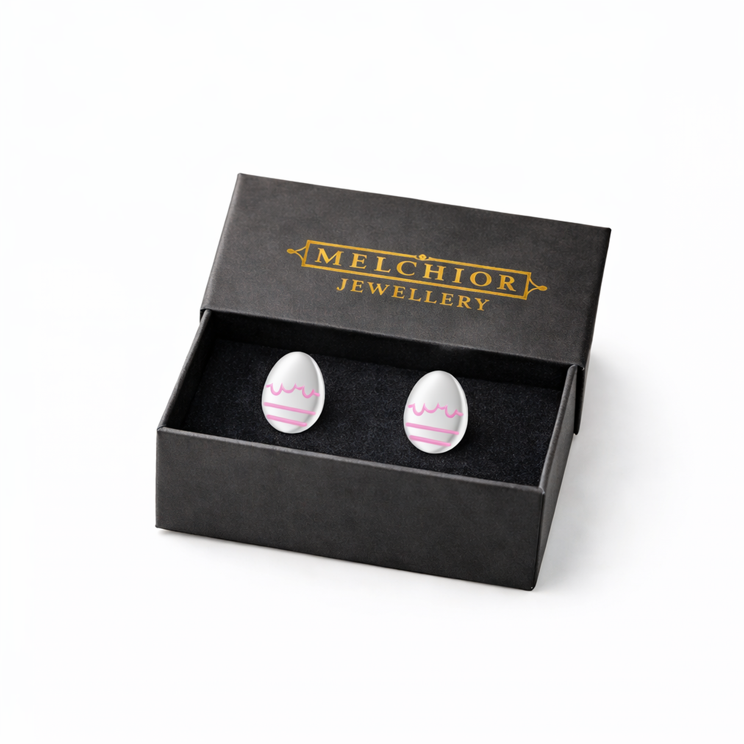 Melchior Jewellery white egg-shaped kids hypoallergenic stud easter earrings with pink decoration in black gift box