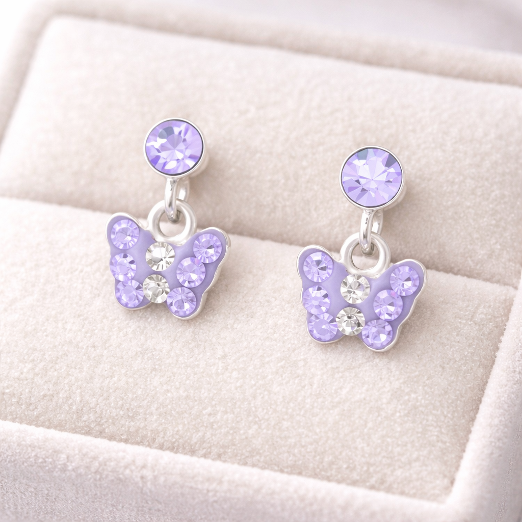 Melchior Jewellery kids lilac drop earrings featuring butterfly design with lilac and clear stones