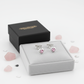 Melchior Jewellery kids pink crystal stud earrings in heart shape displayed on white cushion with black box