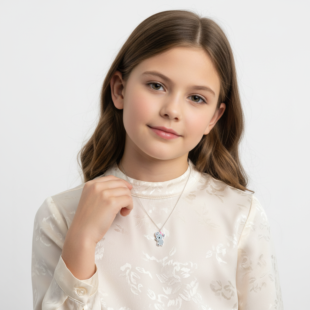 Child wearing Melchior Jewellery childrens necklace with a cute koala bear pendant on silver chain