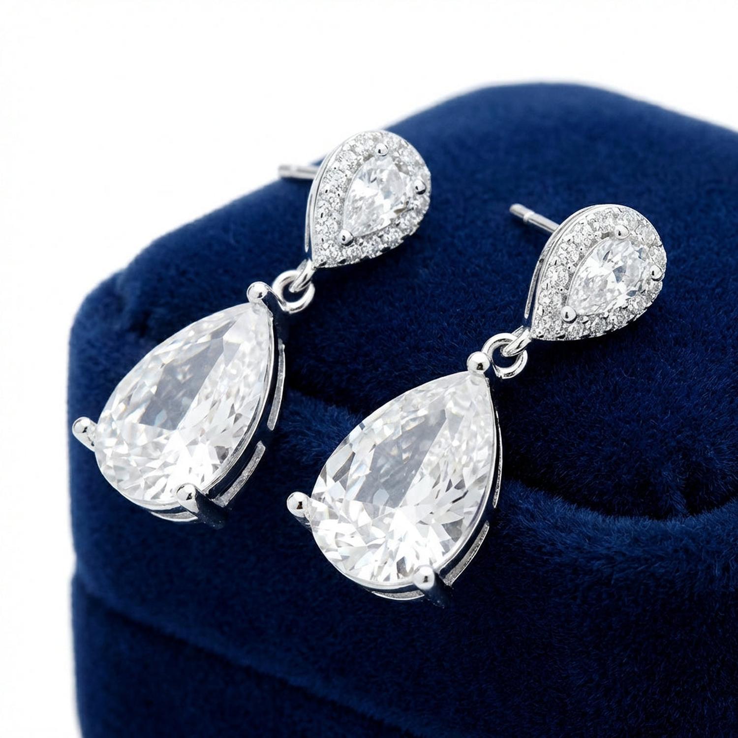 Melchior Jewellery luna wedding earrings for brides with sparkling teardrop crystals in silver setting