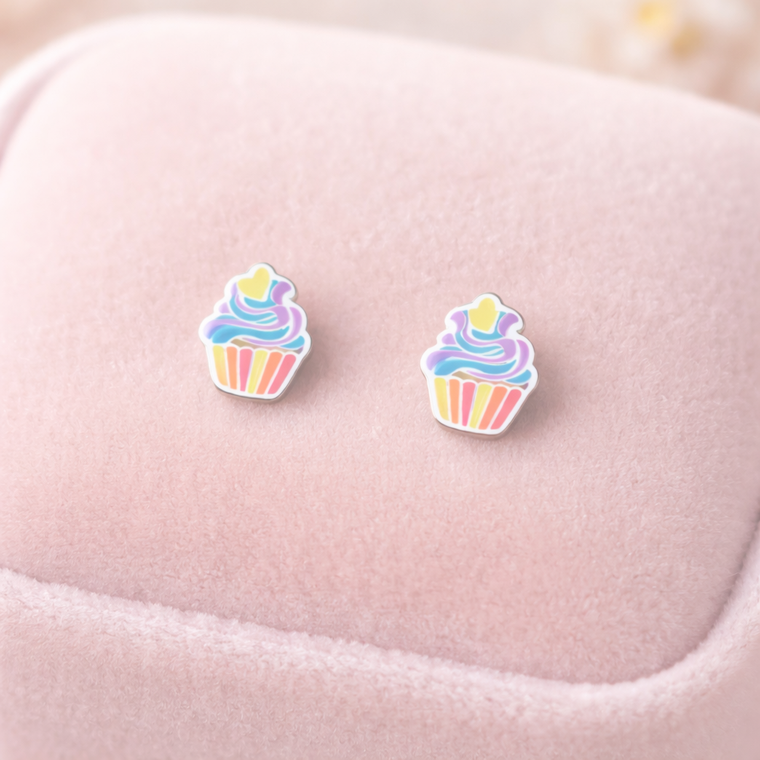 Melchior Jewellery multicolour kids cupcake stud earrings displayed on soft pink fabric background