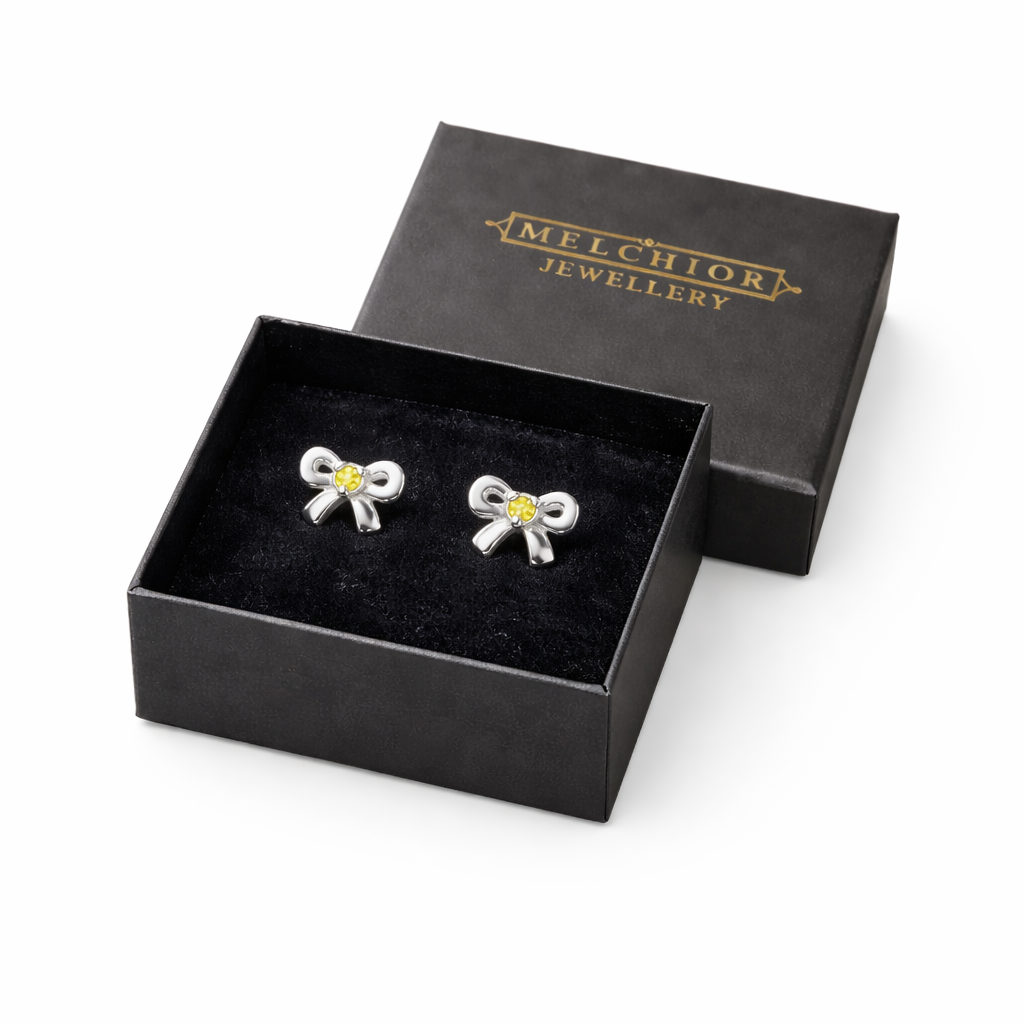 November birthstone earrings for girls by Melchior Jewellery silver bow design with yellow stones in black gift box