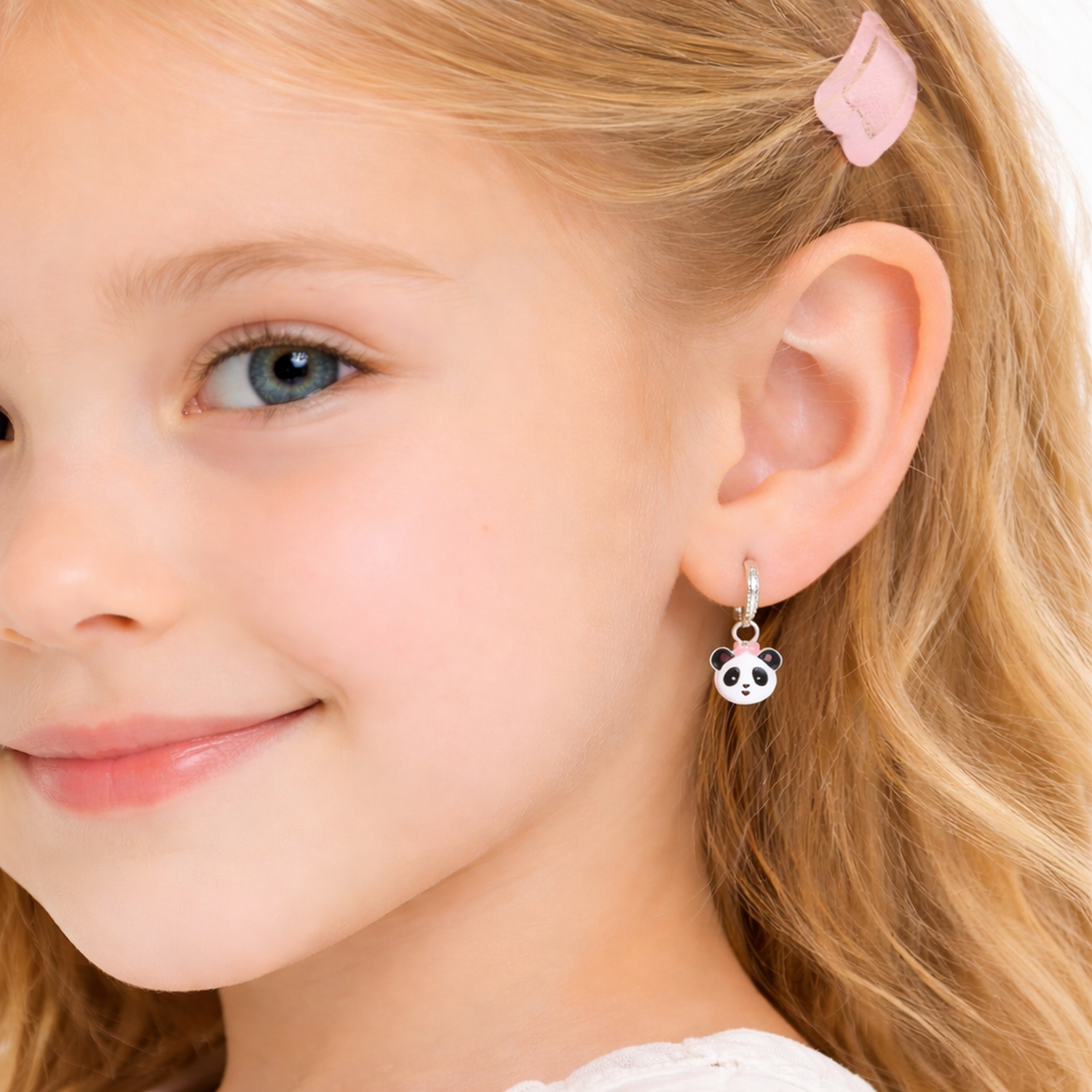 Melchior Jewellery panda bear earrings for girls worn by young girl with blonde hair and pink hair clip