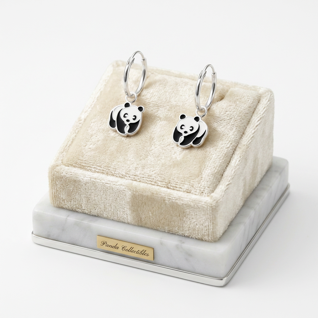 Sterling silver panda bear earrings for girls with black and white enamel details on display stand