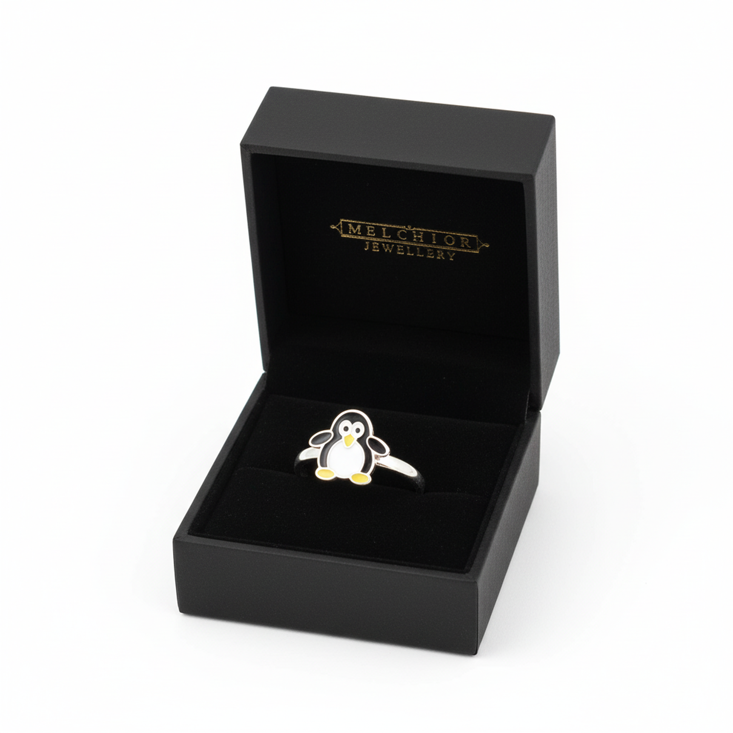 Penguin themed silver ring for children featuring a black and white penguin with yellow feet in a black Melchior Jewellery box