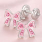 Pink crystal screw back earrings for girls shaped like bows with silver setting by Melchior Jewellery