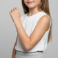 Child wearing Melchior Jewellery pink paw print bracelet for kids on wrist with white top and grey skirt