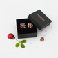 Red glitter ladybird stud earrings for children by Melchior Jewellery displayed in black gift box