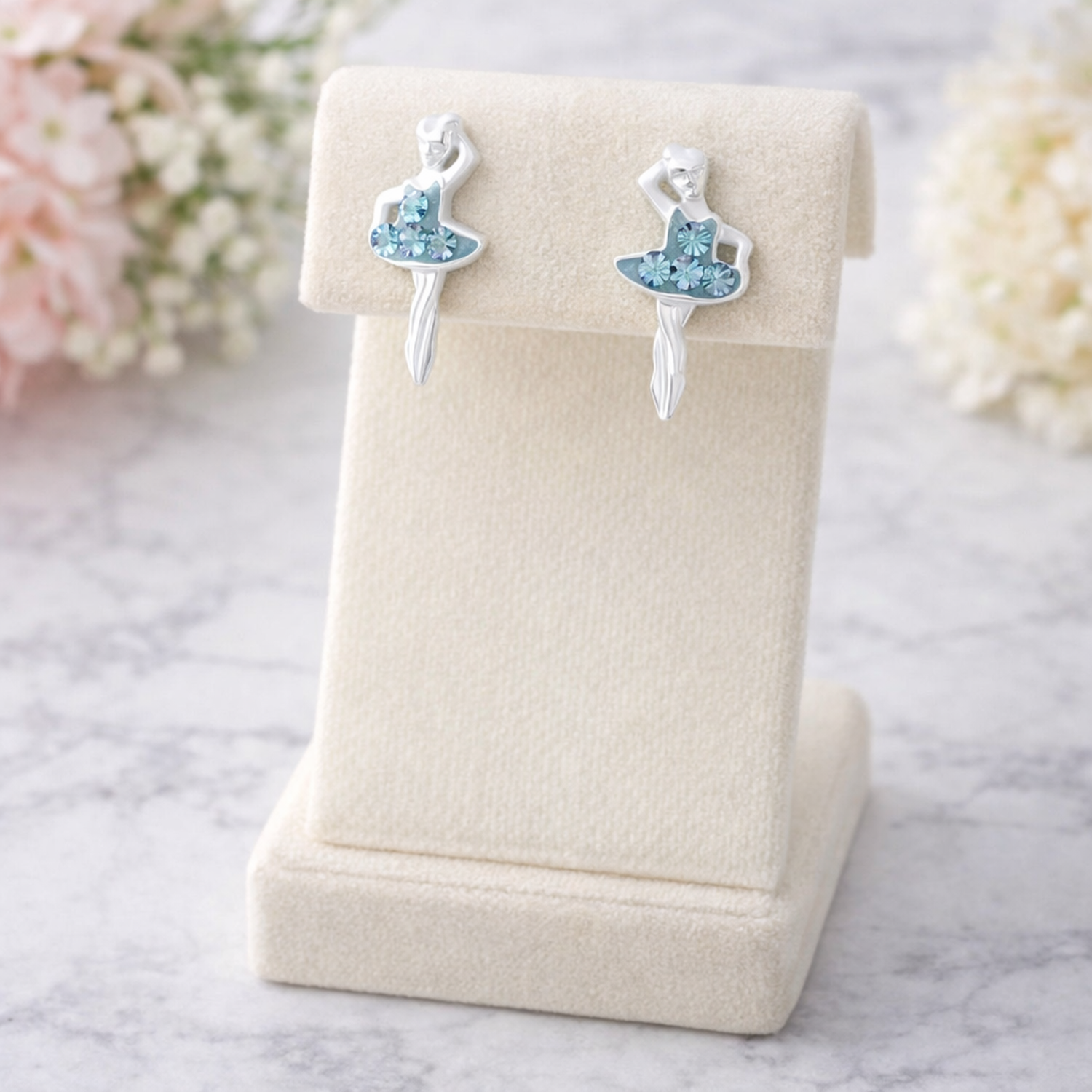 Silver ballet earrings for girls shaped like ballerinas with blue crystal details on display