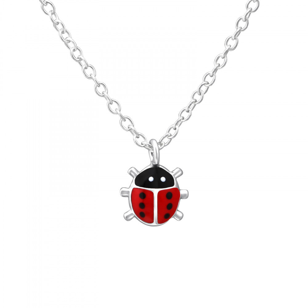 Silver Ladybird Necklace by Melchior Jewellery featuring a red and black enamel ladybird pendant on a delicate silver chain