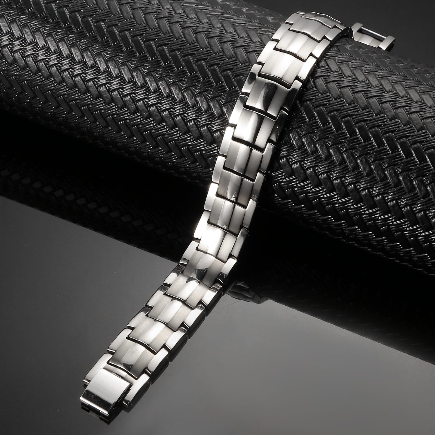 Melchior Jewellery silver titanium magnetic bracelet with sleek modern link design on black background