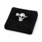Melchior Jewellery single skull earring for men in silver with arrow detail on black velvet pad