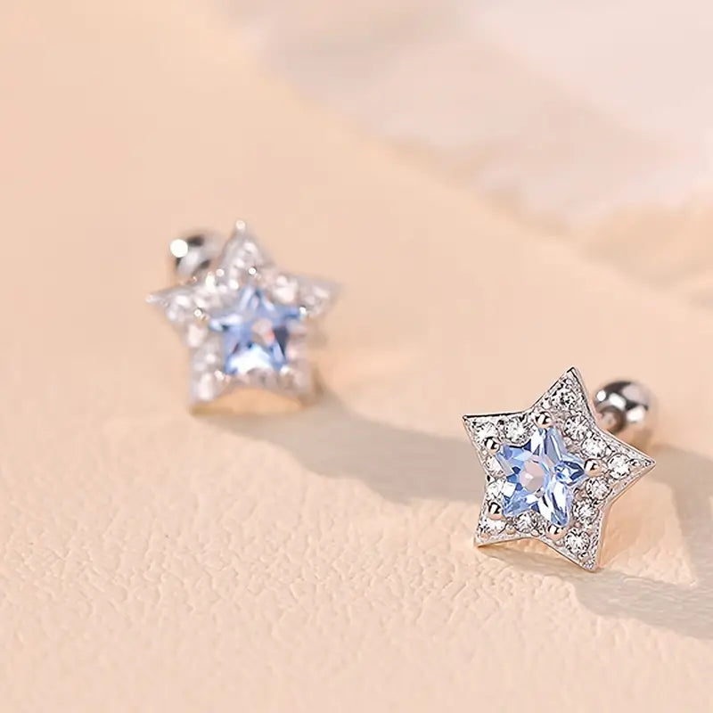 Melchior Jewellery sparkly blue cz screw back earrings for children shaped like stars with blue and clear stones