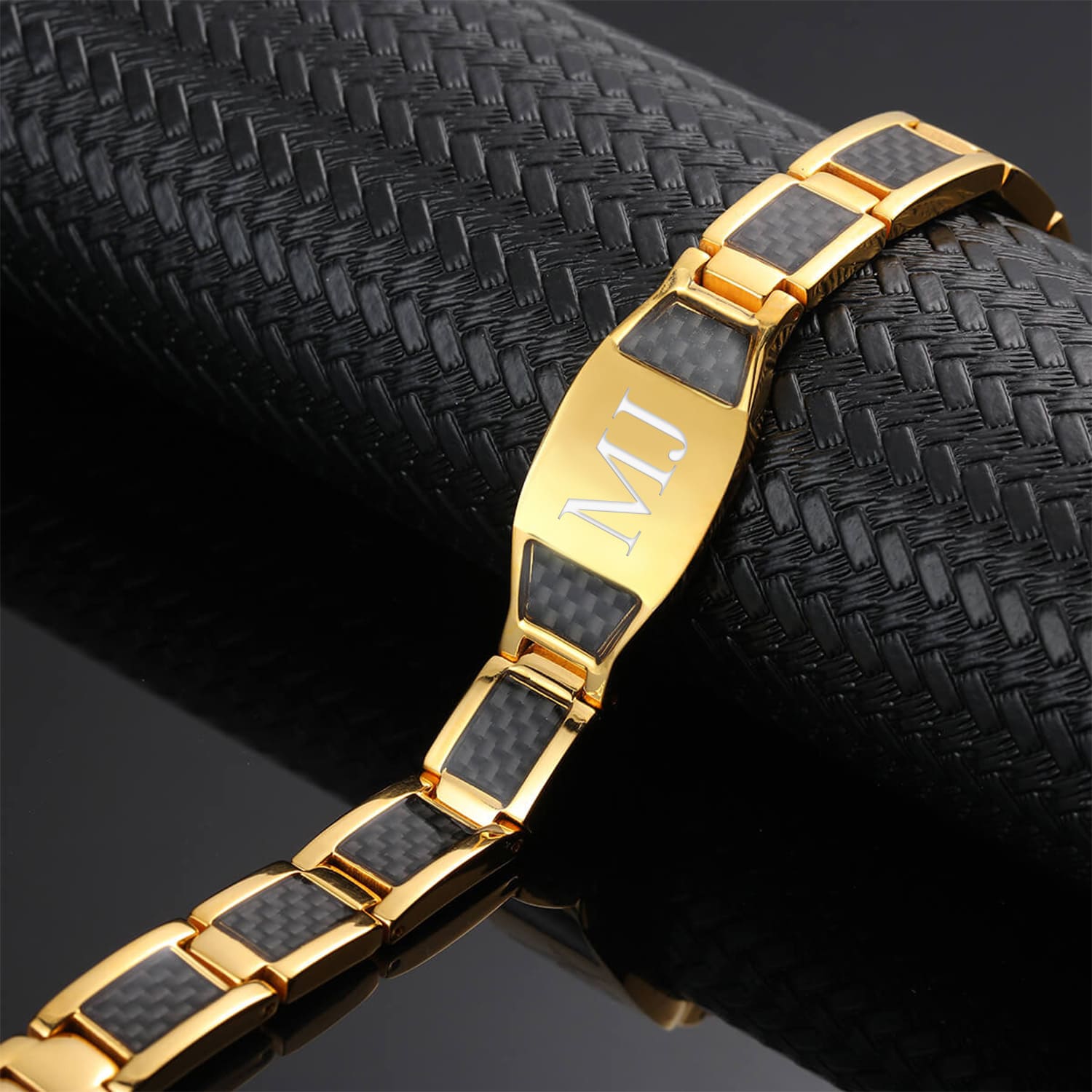 Melchior Jewellery stainless steel gold magnetic therapy bracelet with black carbon fibre inlays and engraved M plate