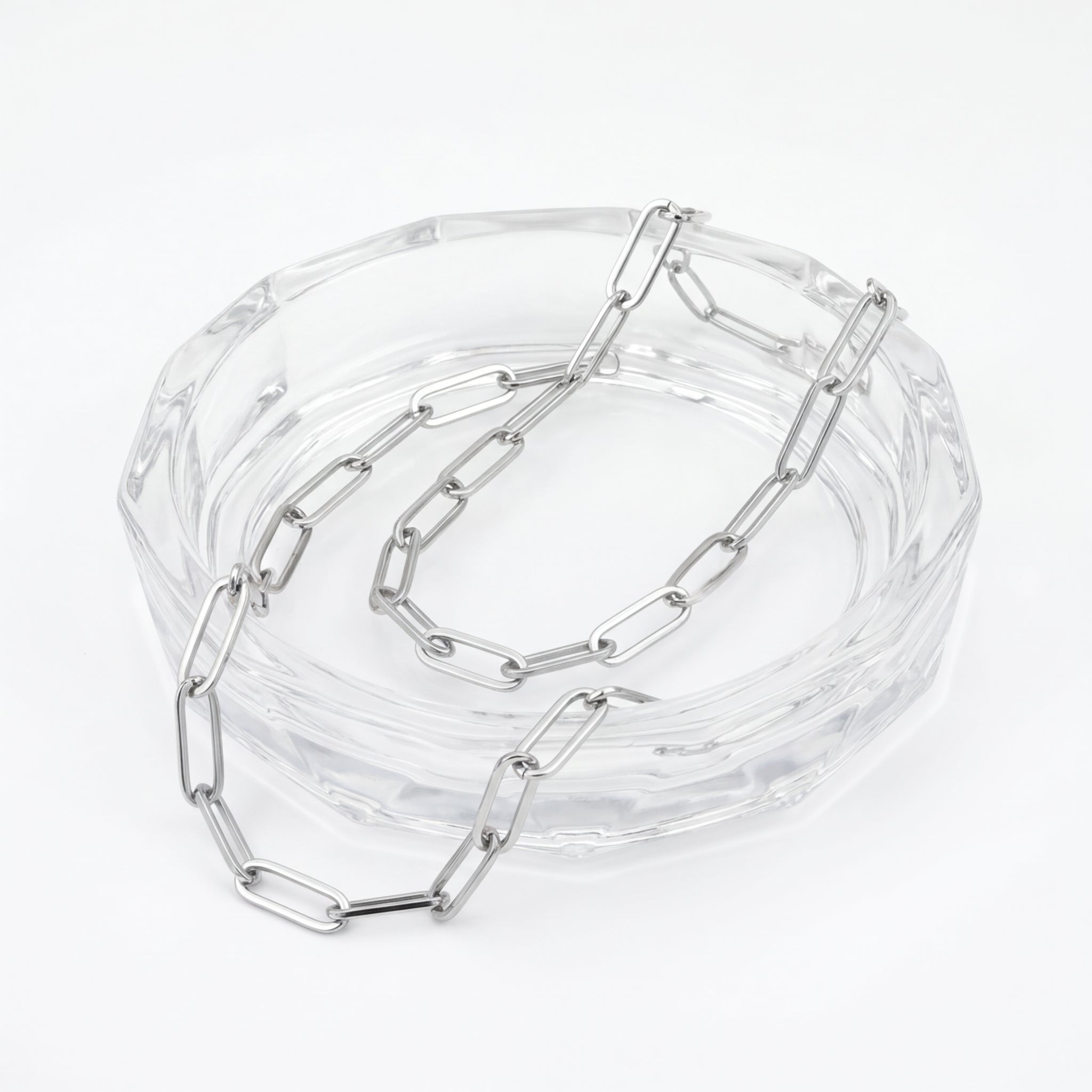 Silver Melchior Jewellery Steel Paperclip Chain Necklace displayed on clear glass dish