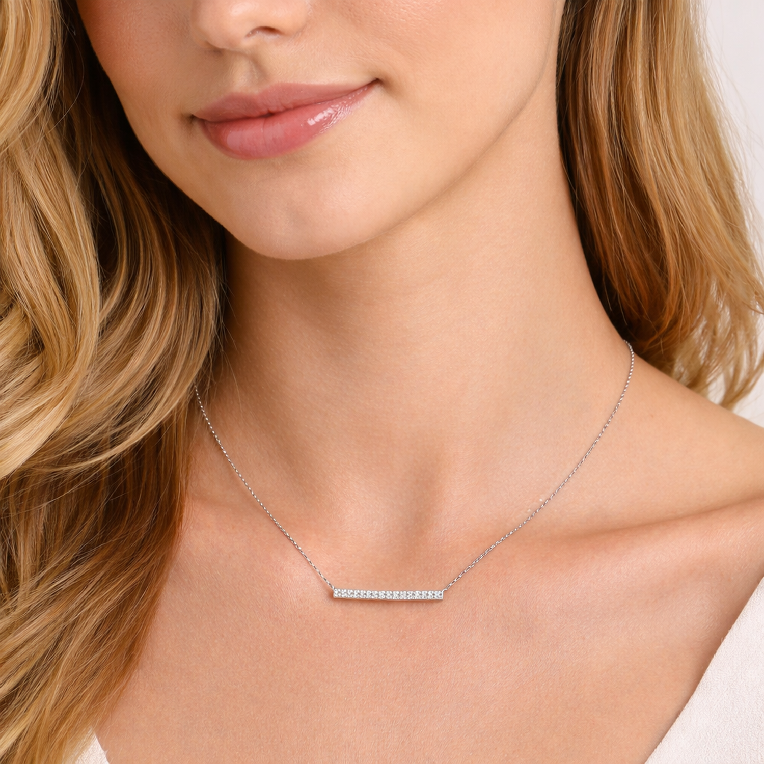 Melchior Jewellery sterling silver bar necklace worn by woman with blonde hair and natural makeup