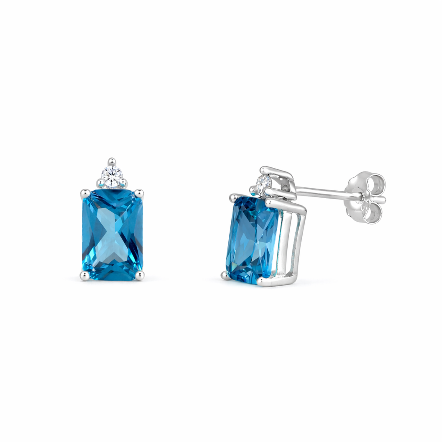 Sterling silver blue topaz earrings with rectangular blue stones and small clear accents by Melchior Jewellery