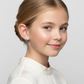 Girl wearing sterling silver dachshund earrings by Melchior Jewellery with a white blouse