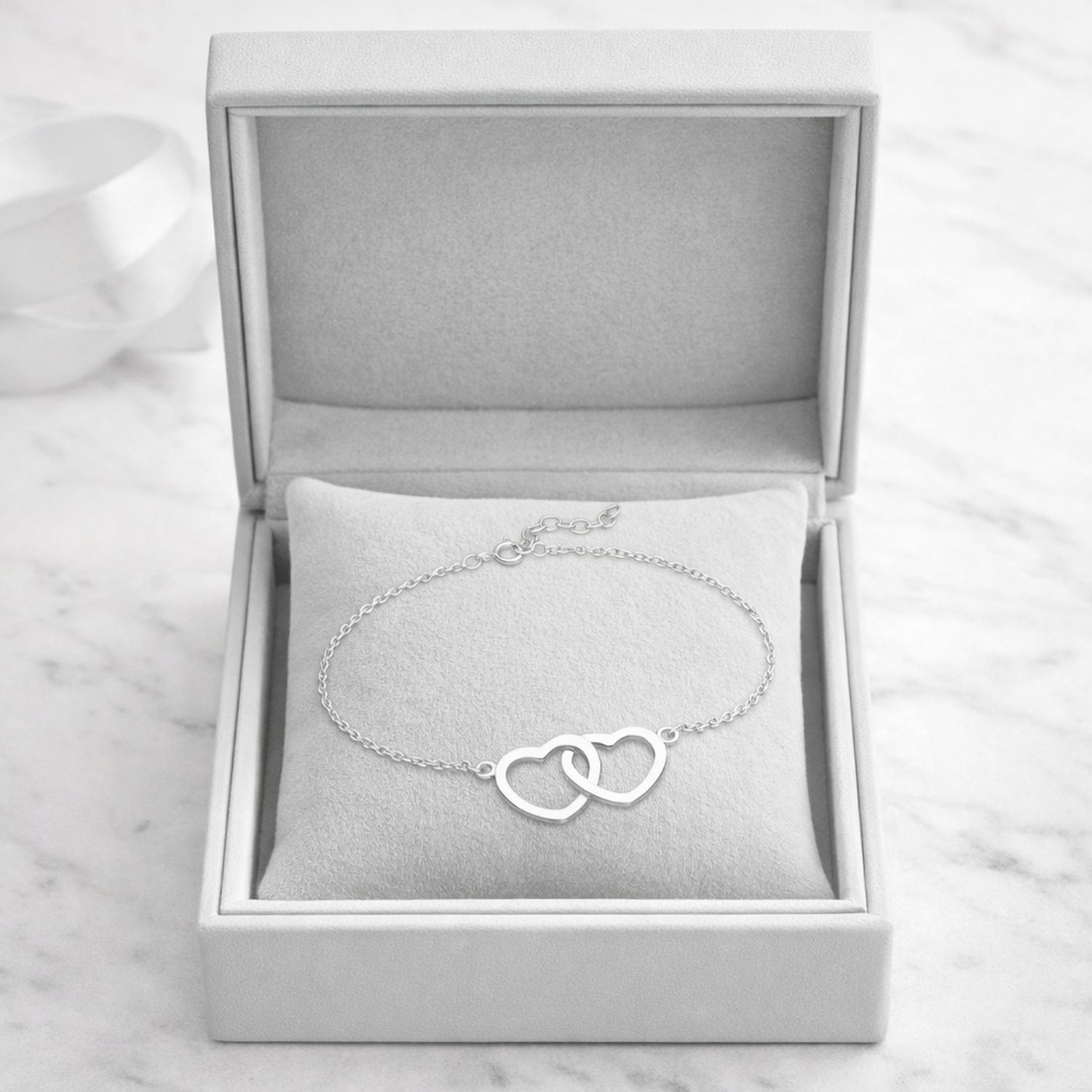 Melchior Jewellery sterling silver double heart bracelet in elegant grey jewellery box on marble surface