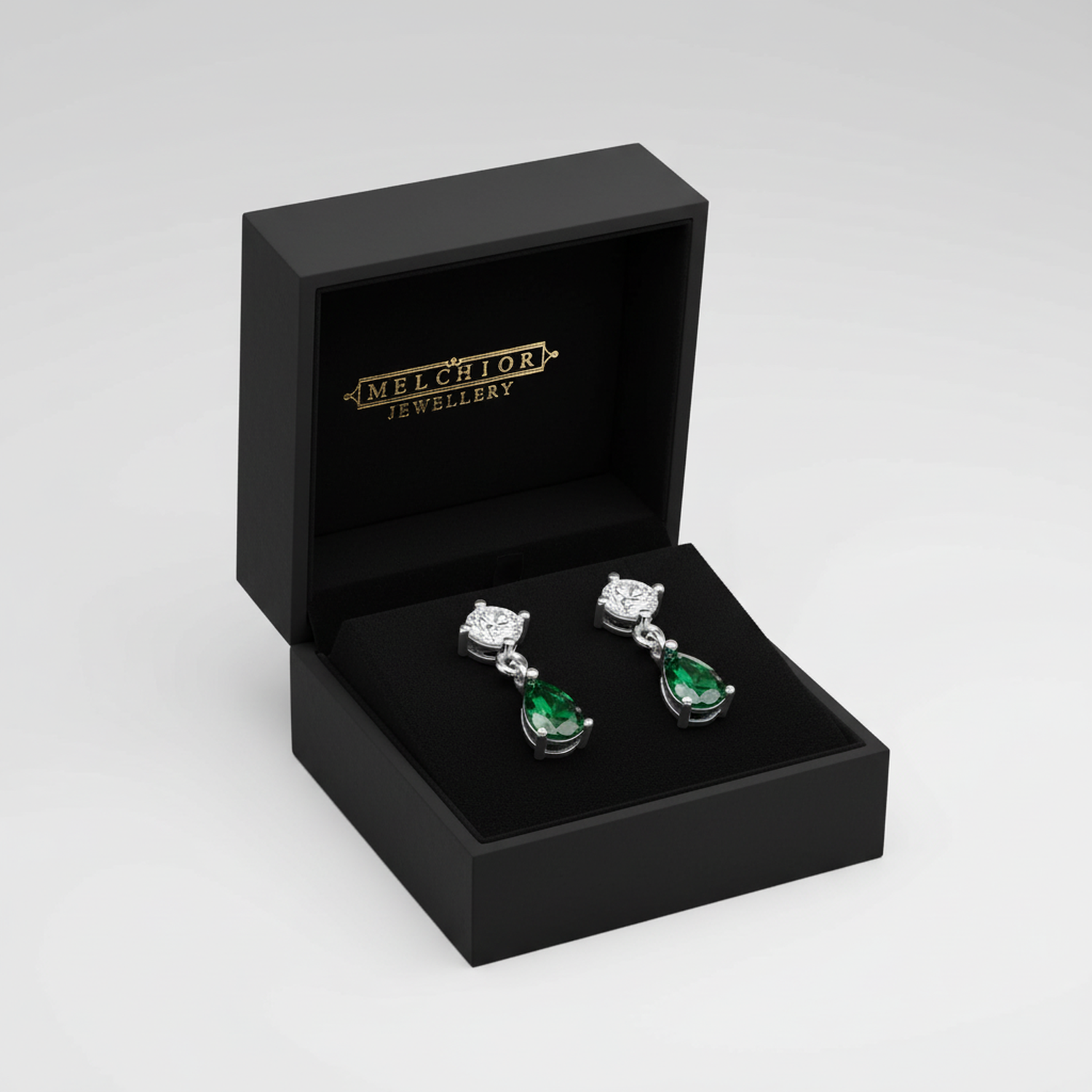 Melchior Jewellery sterling silver emerald drop earrings displayed in a black gift box