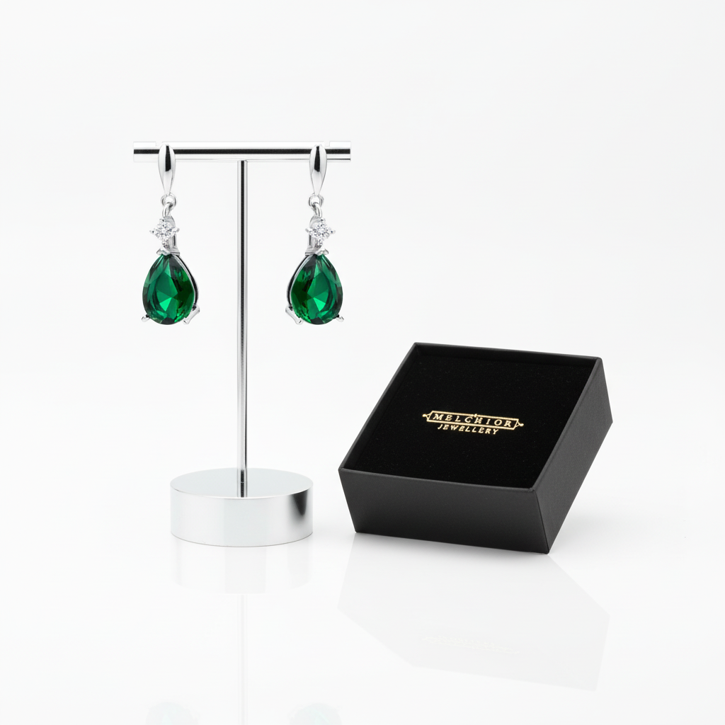 Melchior Jewellery sterling silver emerald drop earrings displayed with black branded box