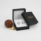 Melchior Jewellery sterling silver football stud earrings in black and white in a black gift box