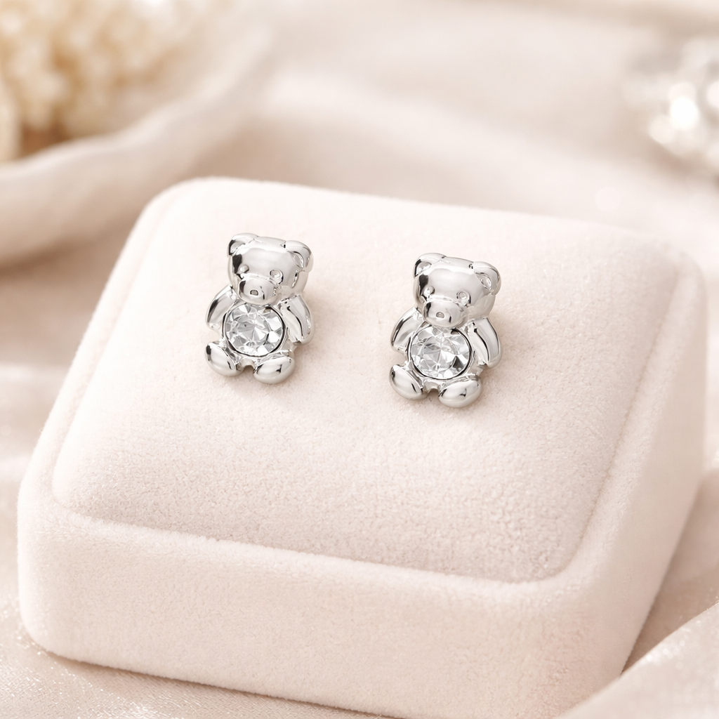 Silver girls april birthstone stud earrings shaped like small teddy bears with clear sparkling stones