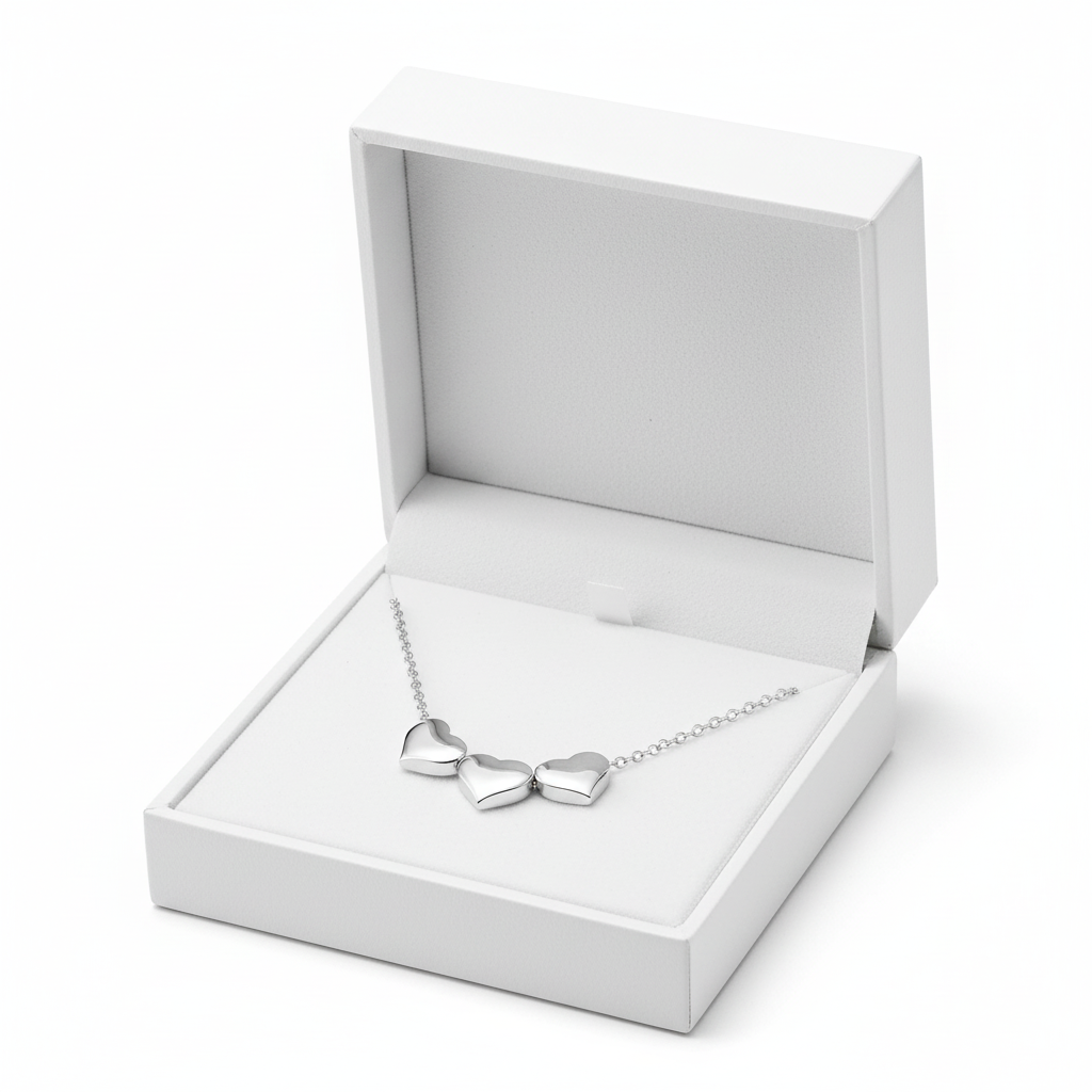 Melchior Jewellery sterling silver heart choker necklace with three heart pendants in a white gift box