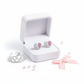 Sterling silver heart earrings for kids in white and pink displayed in a white jewellery box with a small tiara and pink bow
