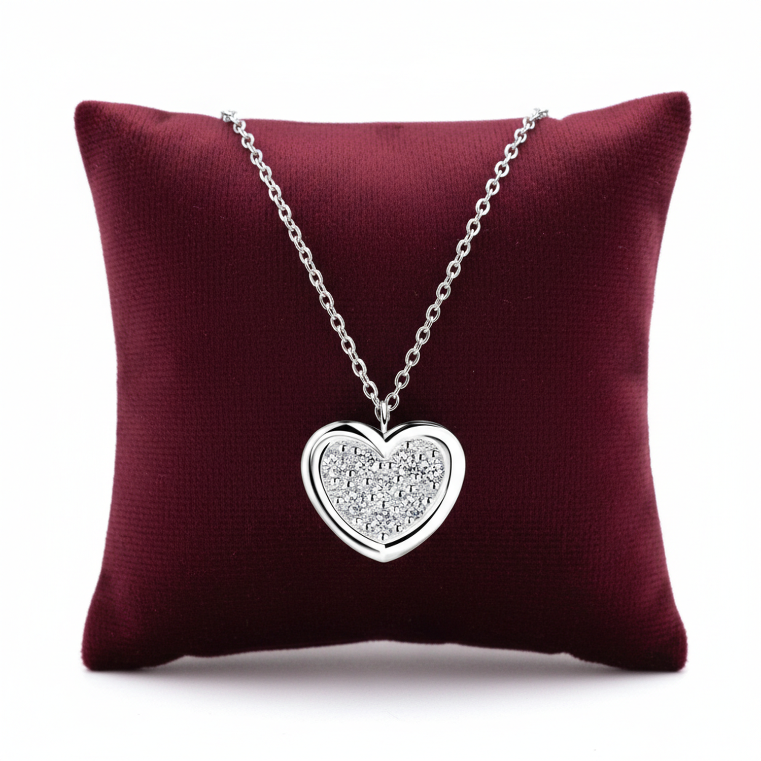 Melchior Jewellery sterling silver heart necklace for woman displayed on burgundy cushion