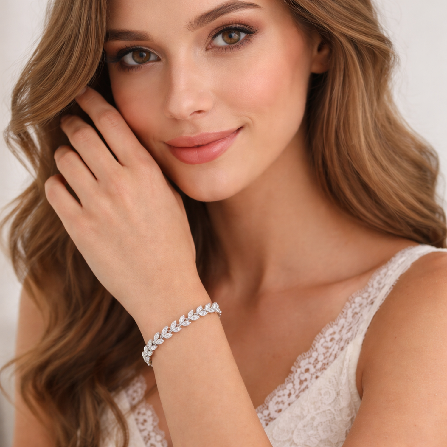 Melchior Jewellery sterling silver leaf bracelet worn on wrist of woman with lace top