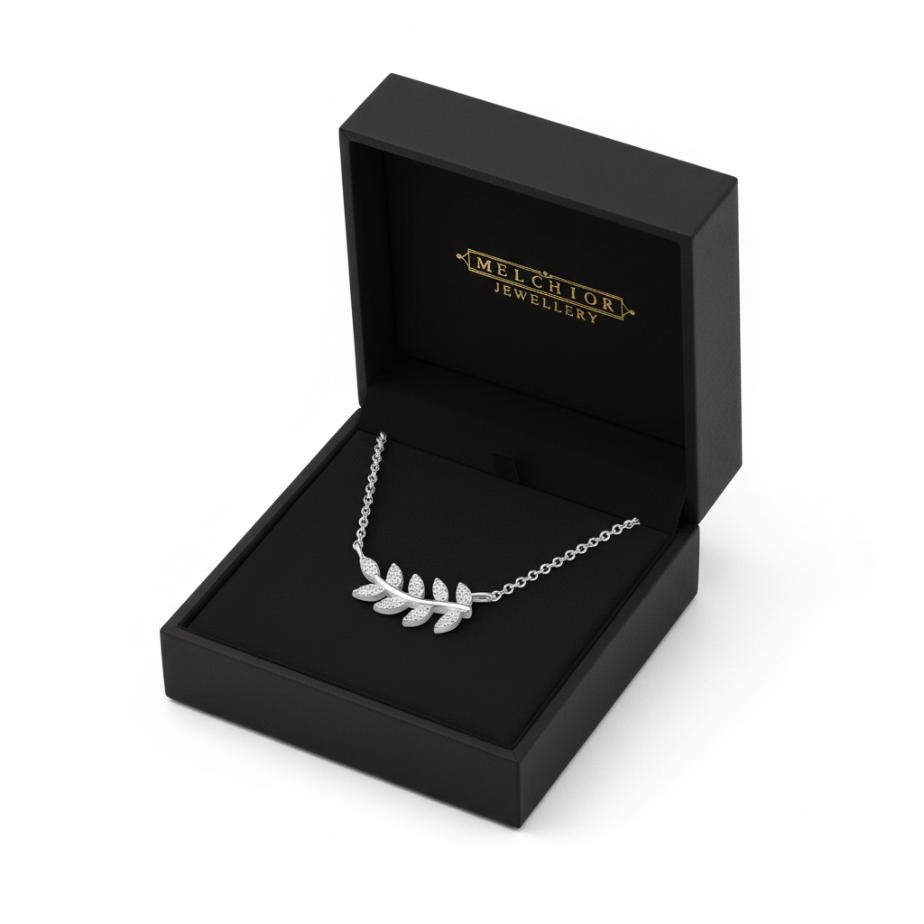 Sterling silver olive leaf necklace from Melchior Jewellery displayed in a black presentation box