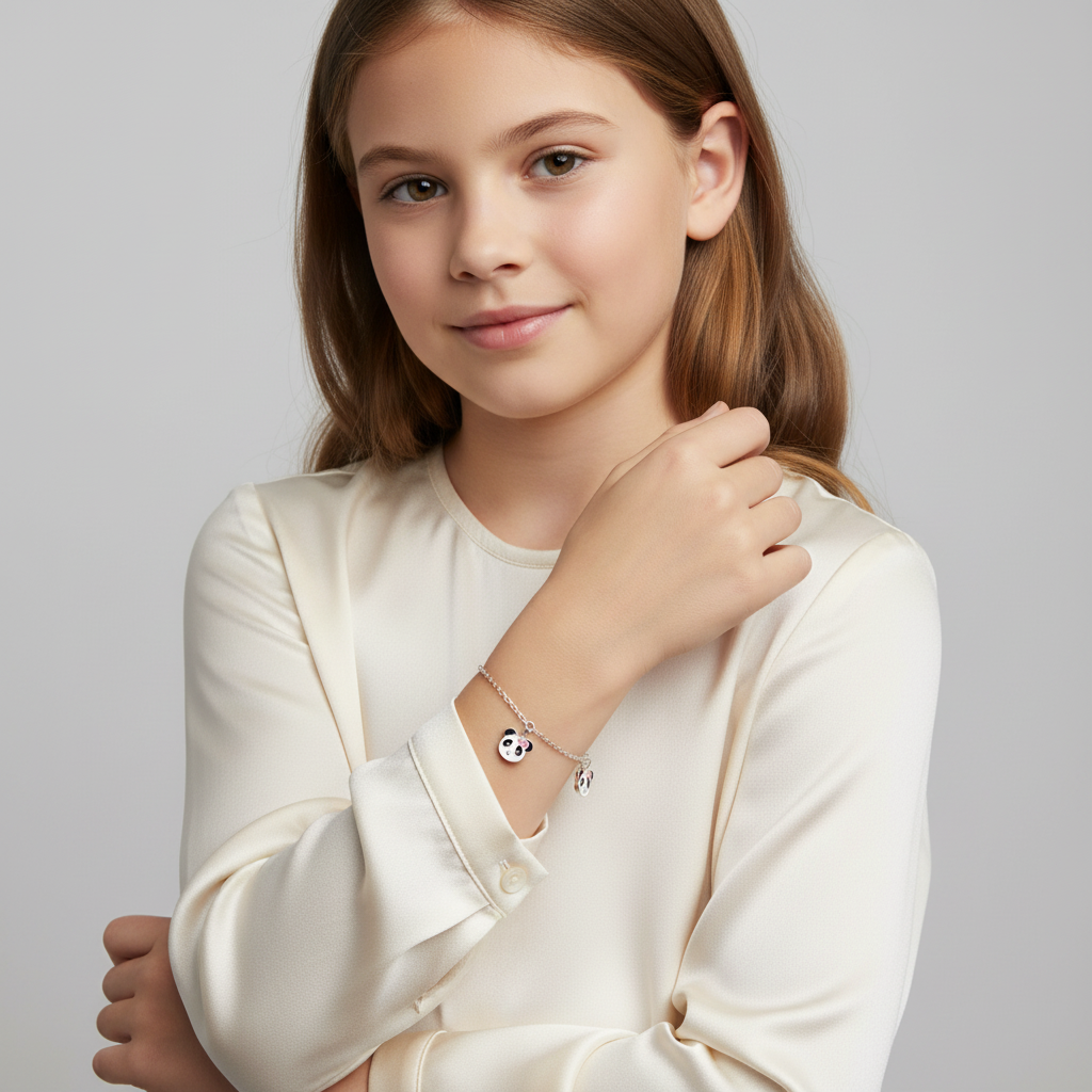 Sterling silver panda charm bracelet for girls worn by young girl in cream blouse by Melchior Jewellery
