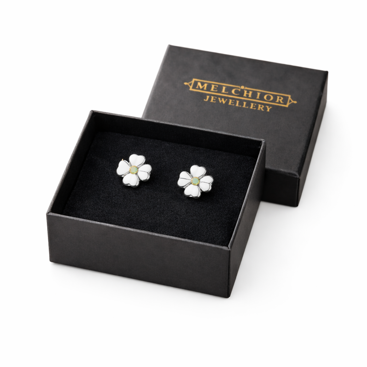 Melchior Jewellery sterling silver peridot stud earrings shaped like delicate white flowers in black gift box